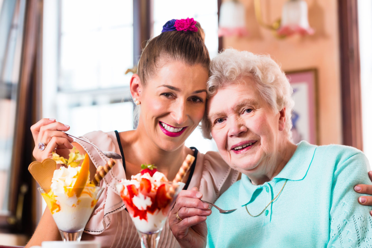 grandma and granddaughter eating ice cream