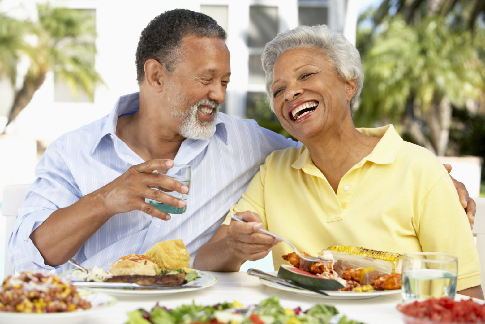 couple smiling eating together